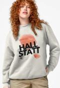 Model wearing Hallstatt-themed sweatshirt with bold text design