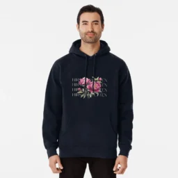 Man wearing a black hoodie with floral design and 'Hirschtetten Vienna' text, casual fashion inspired by Vienna's Hirschtetten neighborhood