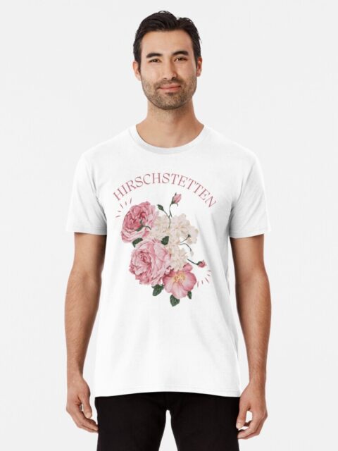 Man wearing a white T-shirt with pink floral design and the word "Hirschstetten."