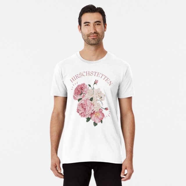 Man wearing a white T-shirt with pink floral design and the word "Hirschstetten."