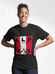Woman wearing a black T-shirt with an "ALP" design featuring alpine-themed graphics.