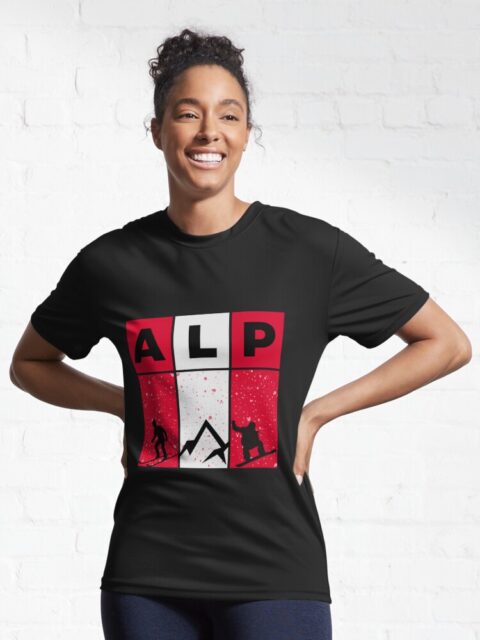 Woman wearing a black T-shirt with an "ALP" design featuring alpine-themed graphics.