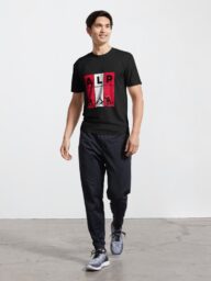 Man wearing a black T-shirt with an "ALP" design featuring alpine-themed graphics.