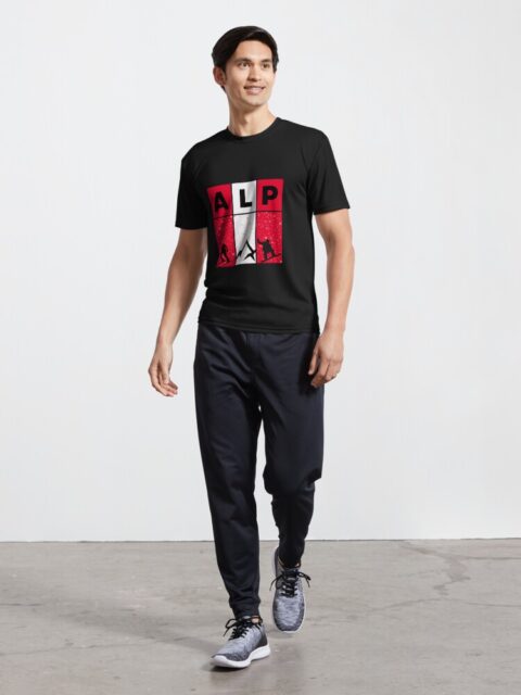 Man wearing a black T-shirt with an "ALP" design featuring alpine-themed graphics.