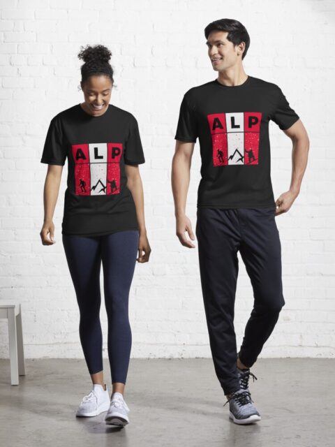 Two people wearing black T-shirts with "ALP" design.