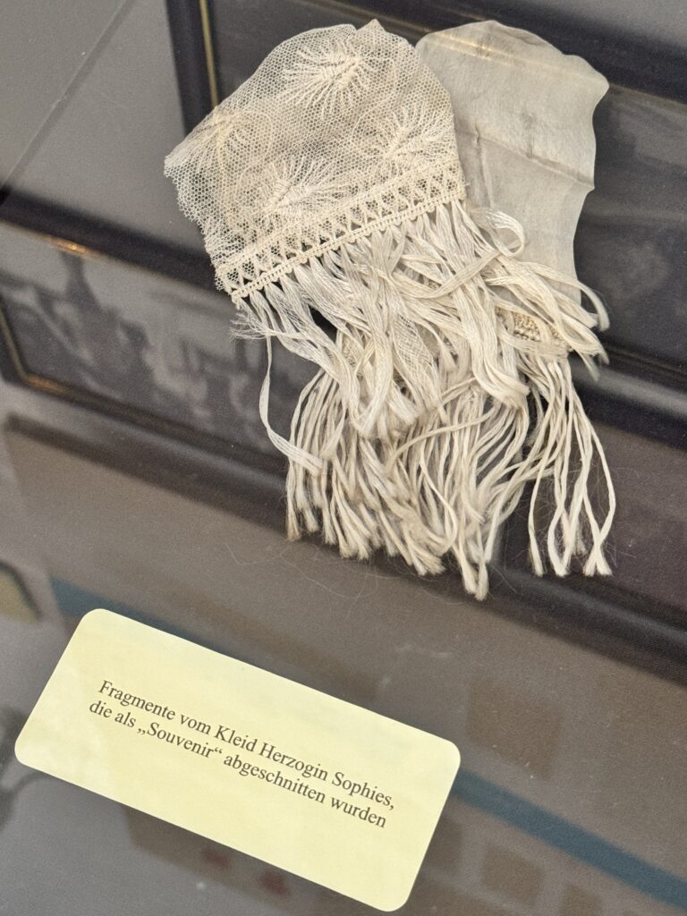 Fragments of Duchess Sophie's dress displayed at Arstetten Castle.