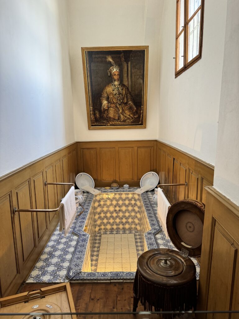 Ornate tiled bath with a portrait of an emperor at Arstetten Castle.