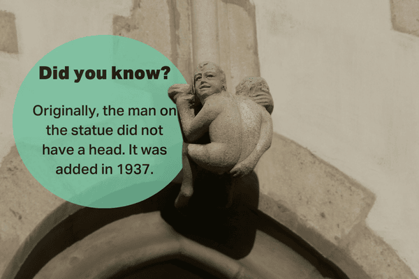 Headless statue detail on St. Jakob Church in Brno, head added in 1937.