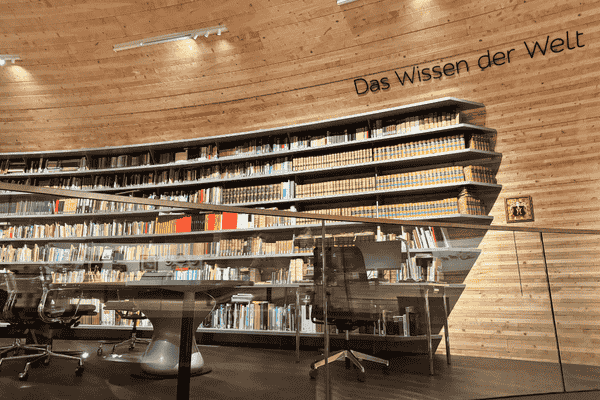 Library section inside Paneum museum with "Das Wissen der Welt" written on the wall