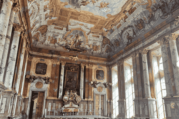 Ornate room with frescoes and columns inside St. Florian Monastery