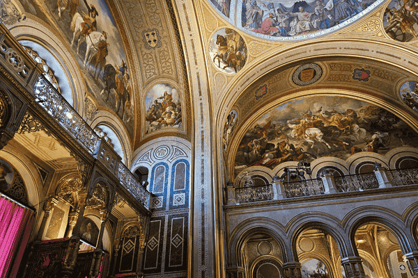 Ornate interior of Heeresgeschichtliches Museum with murals and arches