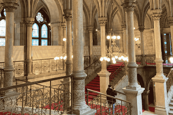 Grand staircase inside Vienna City Hall with red carpet