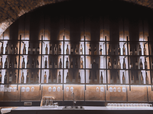 Wine bottle display at the Oldest Vine Museum in Maribor, Slovenia.