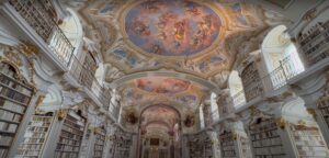 Baroque library interior in Admont Abbey, Austria, with colorful frescoes and bookshelves
